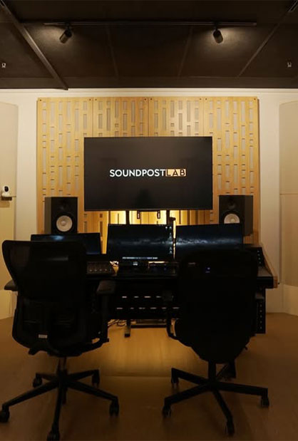 Soundproof recording studio with acoustic panels and microphone setup by Inter-Link Exhibition