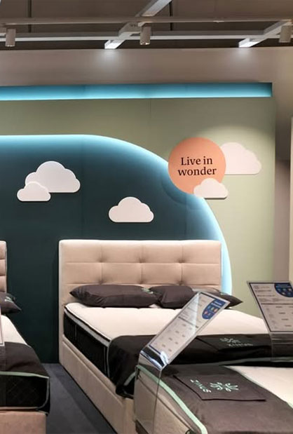 Modern mattress showroom display and retail fit-out by Inter-Link Exhibition
